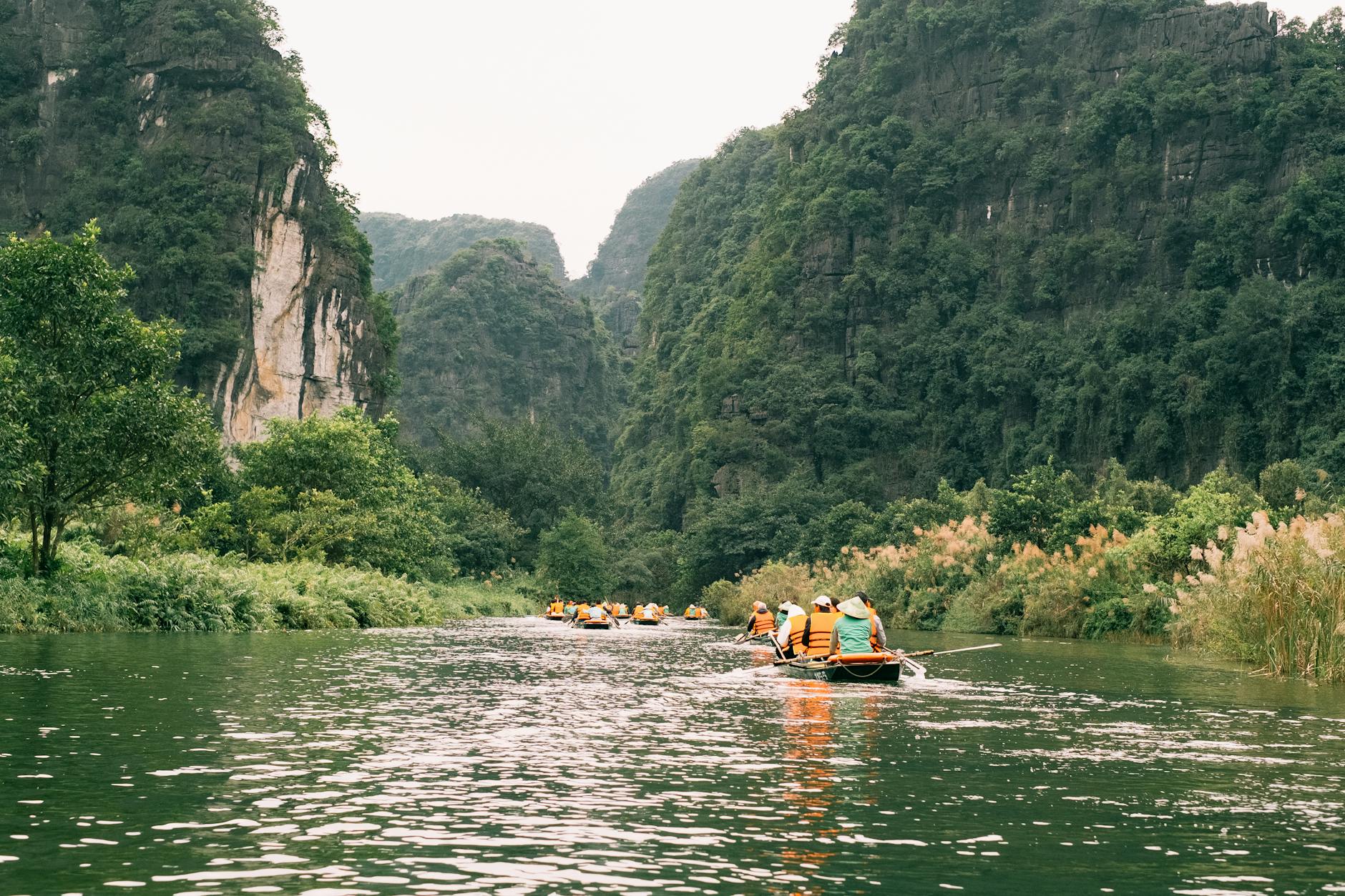 kayakers enjoy scenic river in lush valley